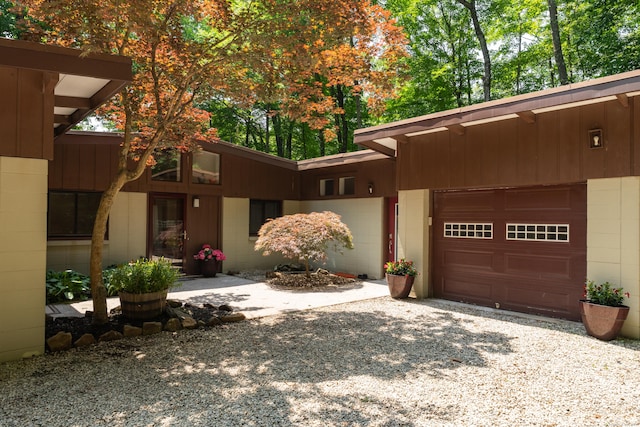 120 Highwoods Dr, Guilford, CT 06437 - mid-century inspired home with concrete block siding, driveway, and a garage