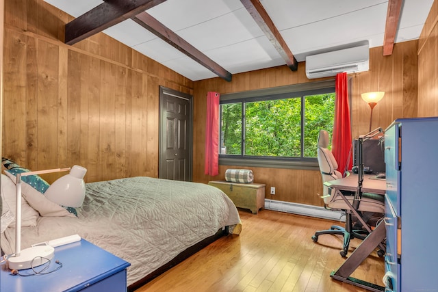 120 Highwoods Dr, Guilford, CT 06437 - bedroom with a wall mounted AC, a baseboard radiator, beamed ceiling, wooden walls, and hardwood / wood-style flooring