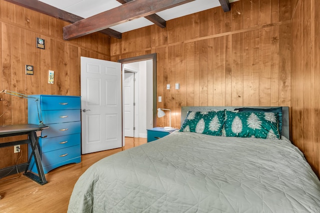 120 Highwoods Dr, Guilford, CT 06437 - bedroom with beam ceiling, wooden walls, and light wood-style flooring