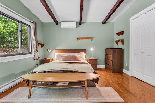 120 Highwoods Dr, Guilford, CT 06437 - bedroom featuring a wall mounted AC, beamed ceiling, light wood-style floors, baseboard heating, and a closet