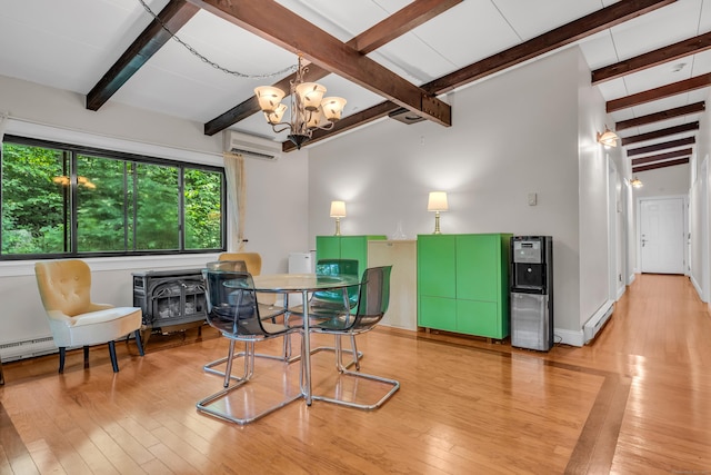 120 Highwoods Dr, Guilford, CT 06437 - dining space featuring a wall unit AC, hardwood / wood-style flooring, a chandelier, beam ceiling, and a baseboard radiator
