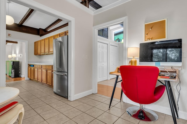 120 Highwoods Dr, Guilford, CT 06437 - kitchen with high end refrigerator, light tile patterned floors, brown cabinets, and beam ceiling