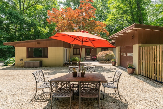 120 Highwoods Dr, Guilford, CT 06437 - view of patio / terrace featuring outdoor dining area and driveway