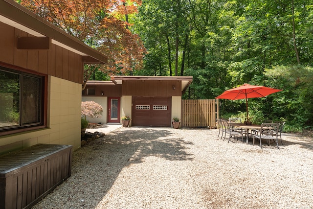 120 Highwoods Dr, Guilford, CT 06437 - view of patio / terrace with an attached garage and driveway