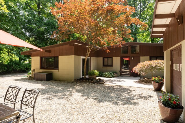 120 Highwoods Dr, Guilford, CT 06437 - view of front of home featuring concrete block siding