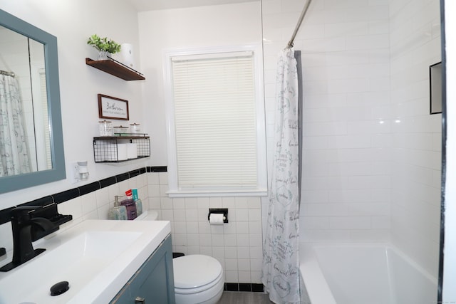 80 Longbranch Ave, Stratford, CT 06615 - full bathroom with tile walls, vanity, shower / bath combo with shower curtain, and wainscoting