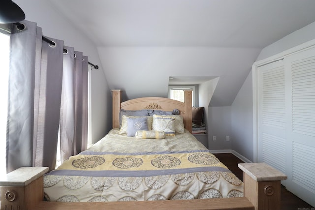 80 Longbranch Ave, Stratford, CT 06615 - bedroom featuring vaulted ceiling, dark wood-style flooring, and a closet