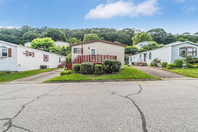 105 Woodland Park, Shelton, CT 06484 - manufactured / mobile home featuring asphalt driveway and a residential view