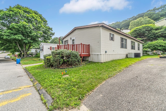 105 Woodland Park, Shelton, CT 06484 - view of side of property featuring a deck and a yard