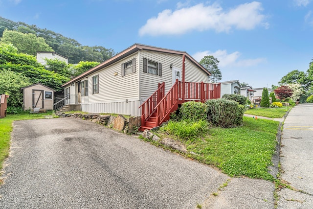 105 Woodland Park, Shelton, CT 06484 - view of front of property with a storage shed, stairway, and a deck
