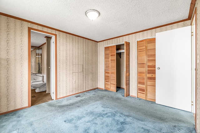 105 Woodland Park, Shelton, CT 06484 - unfurnished bedroom with crown molding, two closets, wallpapered walls, a textured ceiling, and carpet floors