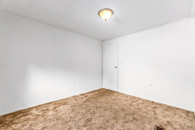 105 Woodland Park, Shelton, CT 06484 - spare room featuring a textured ceiling and carpet