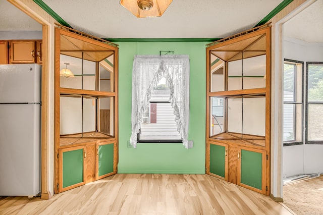 105 Woodland Park, Shelton, CT 06484 - unfurnished dining area with wood finished floors and a textured ceiling