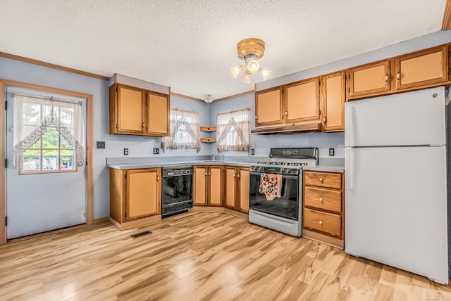 105 Woodland Park, Shelton, CT 06484 - kitchen featuring freestanding refrigerator, gas stove, black dishwasher, light countertops, and under cabinet range hood