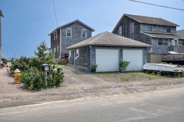 57 Circle Beach Rd, Madison, CT 06443 - view of front of property featuring driveway and a garage