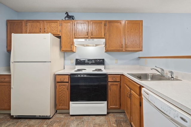 671 Ledgeview Ct Unit 671, Southington, CT 06489 - kitchen featuring white appliances, under cabinet range hood, light countertops, stone finish flooring, and brown cabinetry