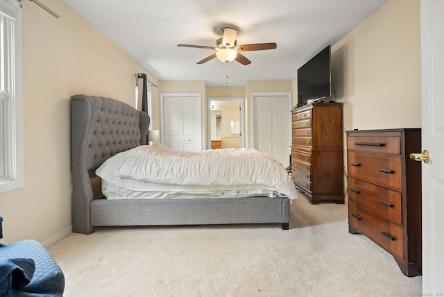 671 Ledgeview Ct Unit 671, Southington, CT 06489 - bedroom with light colored carpet, two closets, and ceiling fan