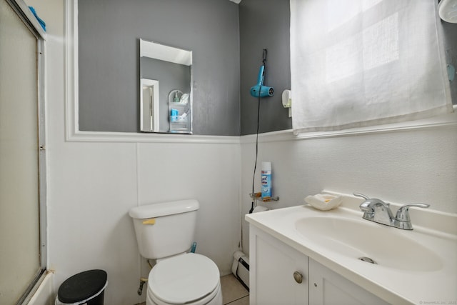 83 James St, New Haven, CT 06513 - bathroom with baseboard heating, vanity, and a shower with shower door