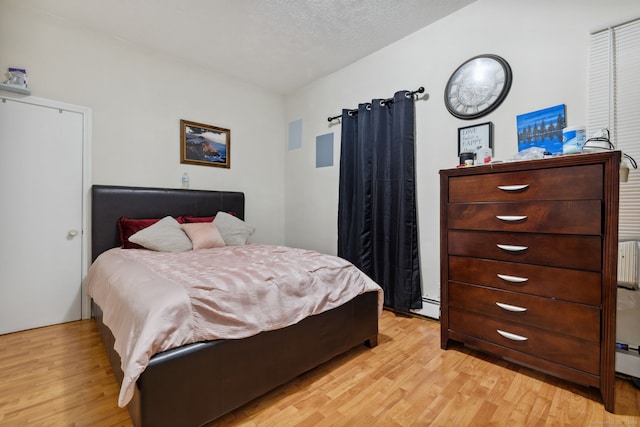 83 James St, New Haven, CT 06513 - bedroom with light wood-style flooring and baseboard heating