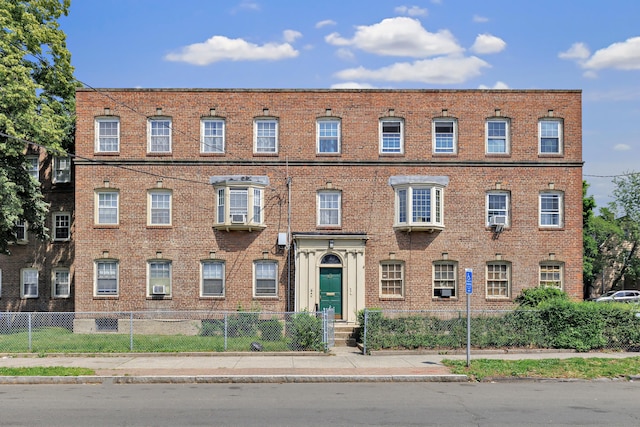 819 Connecticut Ave Unit 6, Bridgeport, CT 06607 - view of front of property with brick siding and a fenced front yard