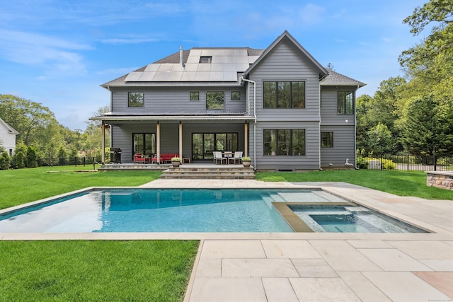 232 Bayberry Ln, Westport, CT 06880 - rear view of house with solar panels, a patio, and a pool with connected hot tub