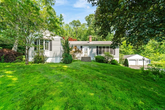 765 Kettletown Rd, Southbury, CT 06488 - view of front of home featuring a front lawn, a detached garage, an outdoor structure, and a chimney