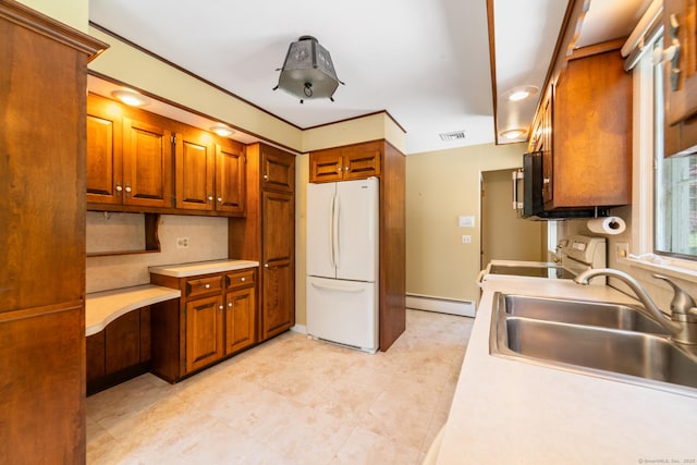 765 Kettletown Rd, Southbury, CT 06488 - kitchen featuring freestanding refrigerator, range, light countertops, brown cabinets, and a baseboard radiator