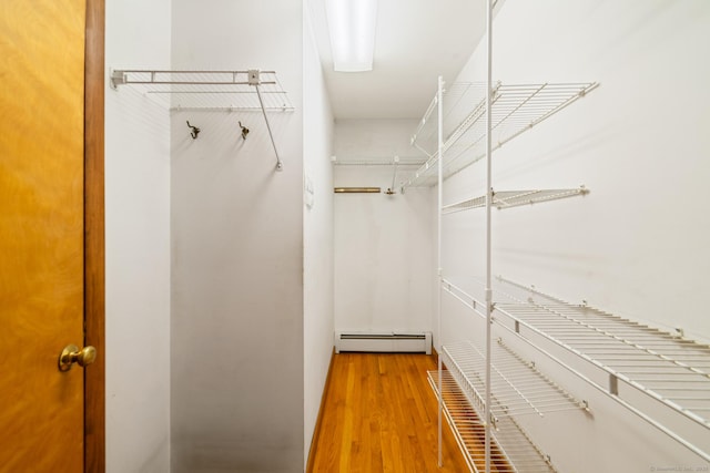 765 Kettletown Rd, Southbury, CT 06488 - walk in closet with a baseboard radiator and wood finished floors