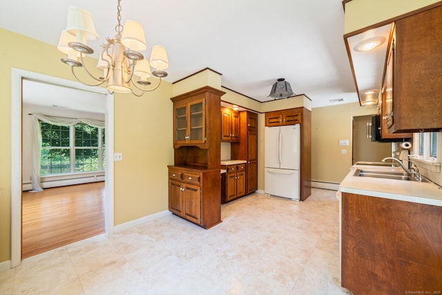 765 Kettletown Rd, Southbury, CT 06488 - kitchen featuring freestanding refrigerator, a chandelier, brown cabinets, a baseboard radiator, and glass insert cabinets