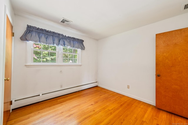 765 Kettletown Rd, Southbury, CT 06488 - spare room with baseboard heating and light wood finished floors