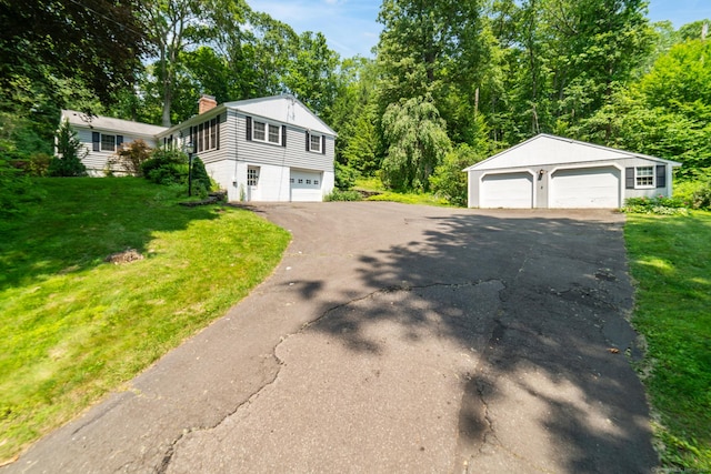 765 Kettletown Rd, Southbury, CT 06488 - view of front of property with a detached garage, a chimney, and a front lawn