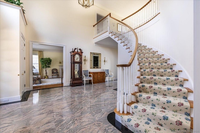 21 Queens Grant Dr, Fairfield, CT 06824 - entrance foyer featuring a towering ceiling, marble tiled floors, and stairway