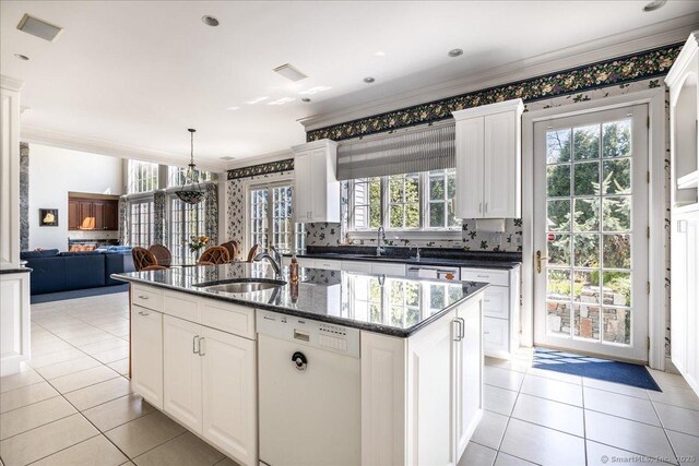 21 Queens Grant Dr, Fairfield, CT 06824 - kitchen featuring white dishwasher, ornamental molding, light tile patterned flooring, decorative backsplash, and a kitchen island with sink