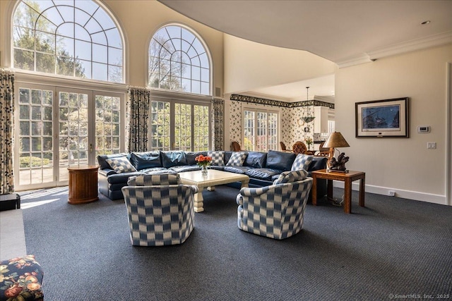 21 Queens Grant Dr, Fairfield, CT 06824 - living room featuring carpet floors, plenty of natural light, a towering ceiling, and ornamental molding