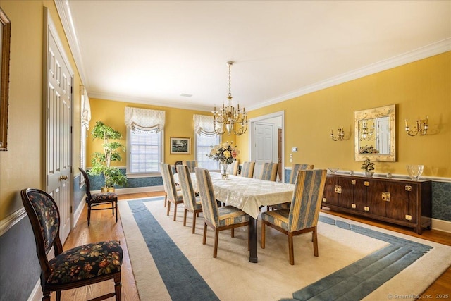 21 Queens Grant Dr, Fairfield, CT 06824 - dining room with a chandelier, wood finished floors, and crown molding