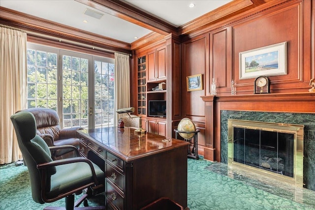 21 Queens Grant Dr, Fairfield, CT 06824 - home office featuring ornamental molding, dark colored carpet, a premium fireplace, and built in shelves