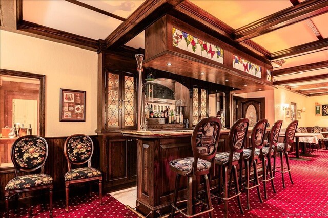21 Queens Grant Dr, Fairfield, CT 06824 - indoor dry bar with beamed ceiling, wainscoting, carpet, coffered ceiling, and ornamental molding