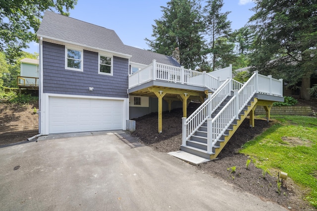 440 Lakeview Dr, Suffield, CT 06093 - view of front of house with driveway, an attached garage, roof with shingles, and stairs