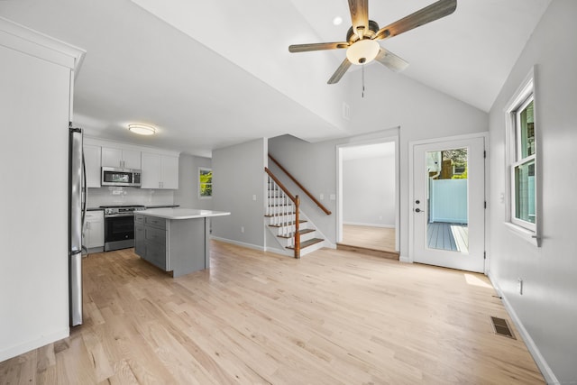440 Lakeview Dr, Suffield, CT 06093 - kitchen with stainless steel appliances, healthy amount of natural light, light wood-style flooring, light countertops, and lofted ceiling