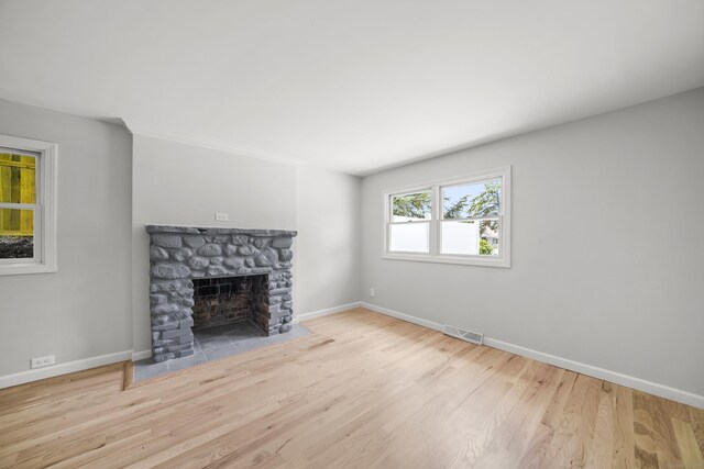 440 Lakeview Dr, Suffield, CT 06093 - unfurnished living room with wood finished floors and a fireplace
