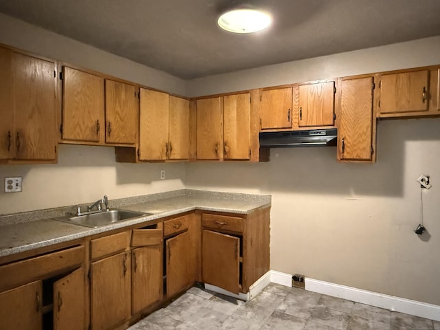 122 Clark St Unit B, Hartford, CT 06120 - kitchen featuring under cabinet range hood, brown cabinets, and light countertops