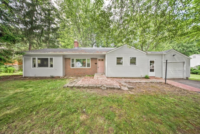 134 Sunset St, Windsor Locks, CT 06096 - ranch-style house featuring a garage, a chimney, brick siding, and a front lawn