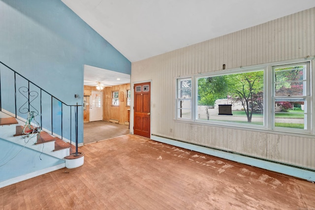 134 Sunset St, Windsor Locks, CT 06096 - foyer entrance featuring a baseboard radiator, stairway, wood finished floors, high vaulted ceiling, and wooden walls
