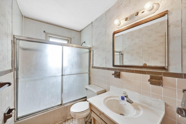 134 Sunset St, Windsor Locks, CT 06096 - full bathroom with tile walls, vanity, and combined bath / shower with glass door