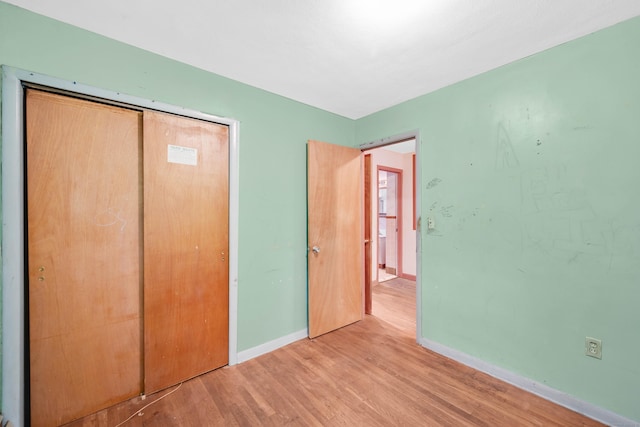 134 Sunset St, Windsor Locks, CT 06096 - unfurnished bedroom featuring wood finished floors and a closet