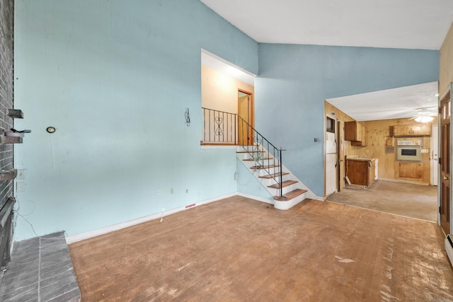 134 Sunset St, Windsor Locks, CT 06096 - entryway with a fireplace, a high ceiling, concrete flooring, stairway, and a ceiling fan