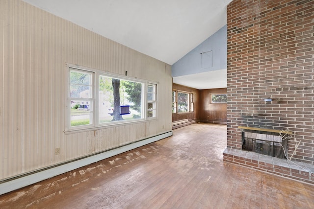 134 Sunset St, Windsor Locks, CT 06096 - unfurnished living room with hardwood / wood-style floors, a baseboard heating unit, high vaulted ceiling, a brick fireplace, and wood walls