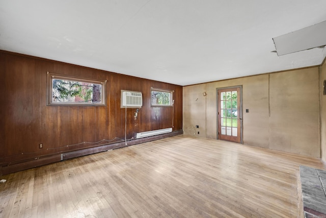134 Sunset St, Windsor Locks, CT 06096 - spare room with a wall mounted air conditioner, wood finished floors, and wood walls