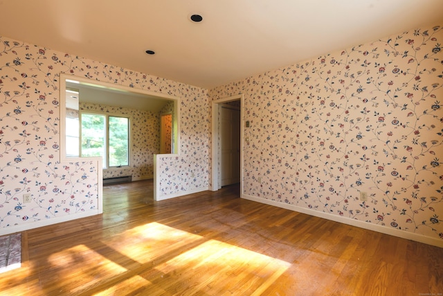 22 Trumbull Rd, Waterford, CT 06385 - empty room featuring light wood-style floors and wallpapered walls