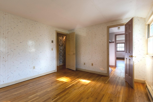 22 Trumbull Rd, Waterford, CT 06385 - unfurnished room featuring wood finished floors and a baseboard heating unit